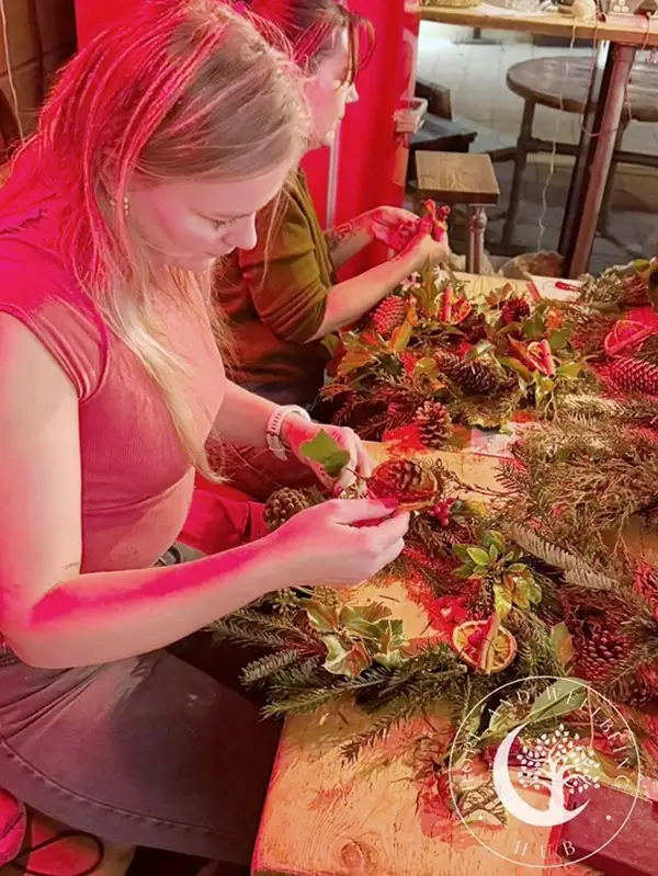 two ladies making wreaths